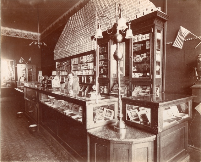 Peter Zimmerman standing behind the counter of his Cigar Factory Shop. Lyle Kotchen Collection 
