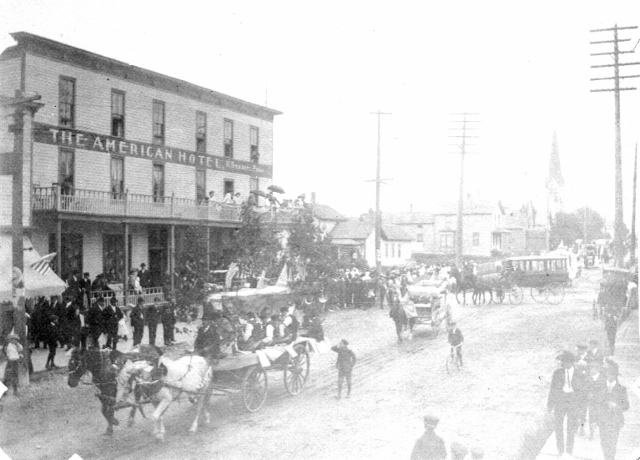 Peter Zimmerman Float in the 4th of July Parade on Oak Street. Cigar makers are rolling cigars and throwing them to the people. Lyle Kotchen Collection
