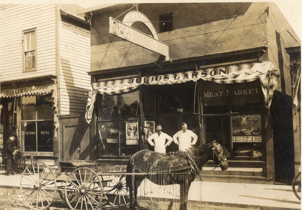 The City Meat Market was  opened in 1899. It stood on Oak Street next to the Barnes Hotel. In the above photo, posters can be seen in the widows advertising coming attractions at the opera house.