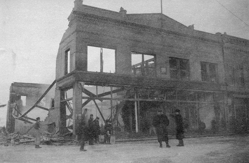 The burned out shell of Rose Brothers Department Store on the corner of Oak and Cedar Streets is pictured here on December 25, 1906.