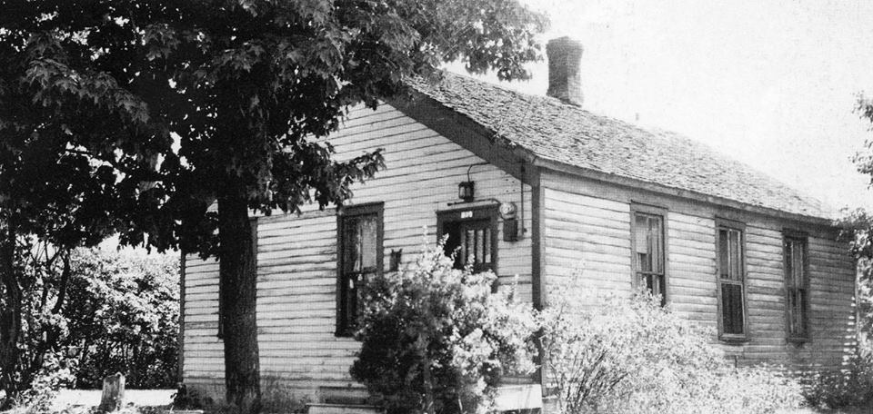 Manistique's first school house where MacMurray held church services