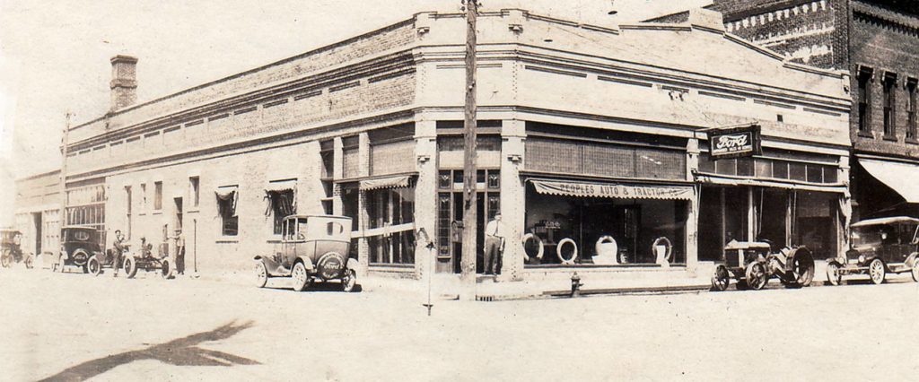 The People’s Auto and Tractor Supply Company and the Ford Dealership shared the McNamara building during the late 1920’s. The Ford dealership has continued through 2016, but will soon be moving to US 2.