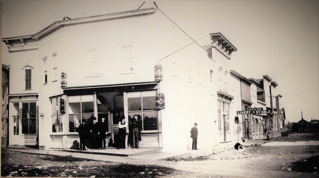 The Arcade Saloon owned by the Heffron brothers stood at the corner of Pearl and Water Streets on the Flat Iron Block.